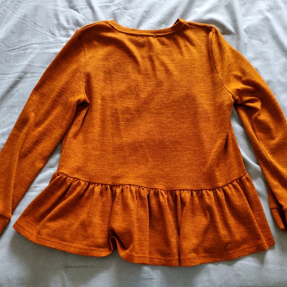 Orange peplum top